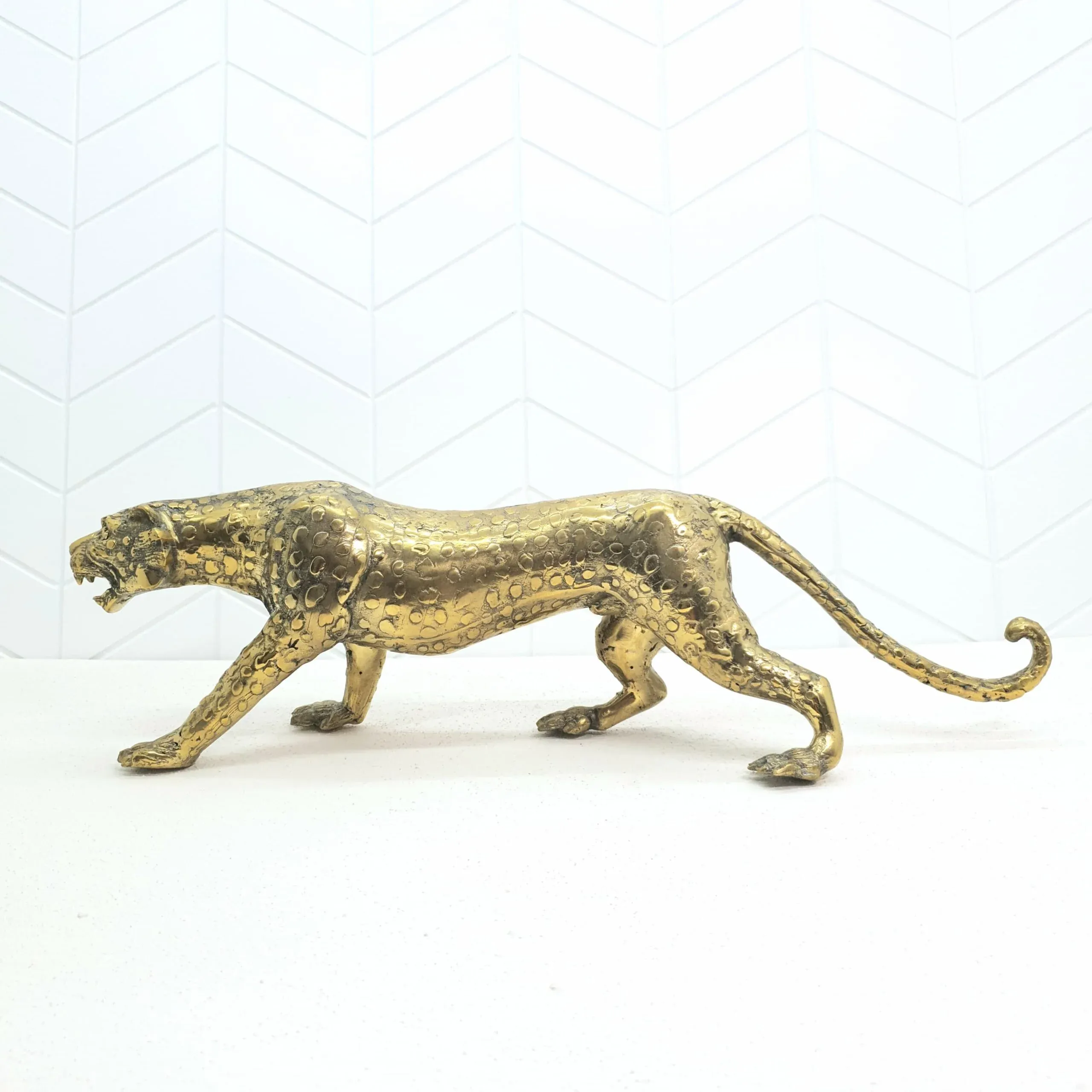 Leopard bronze sculpture