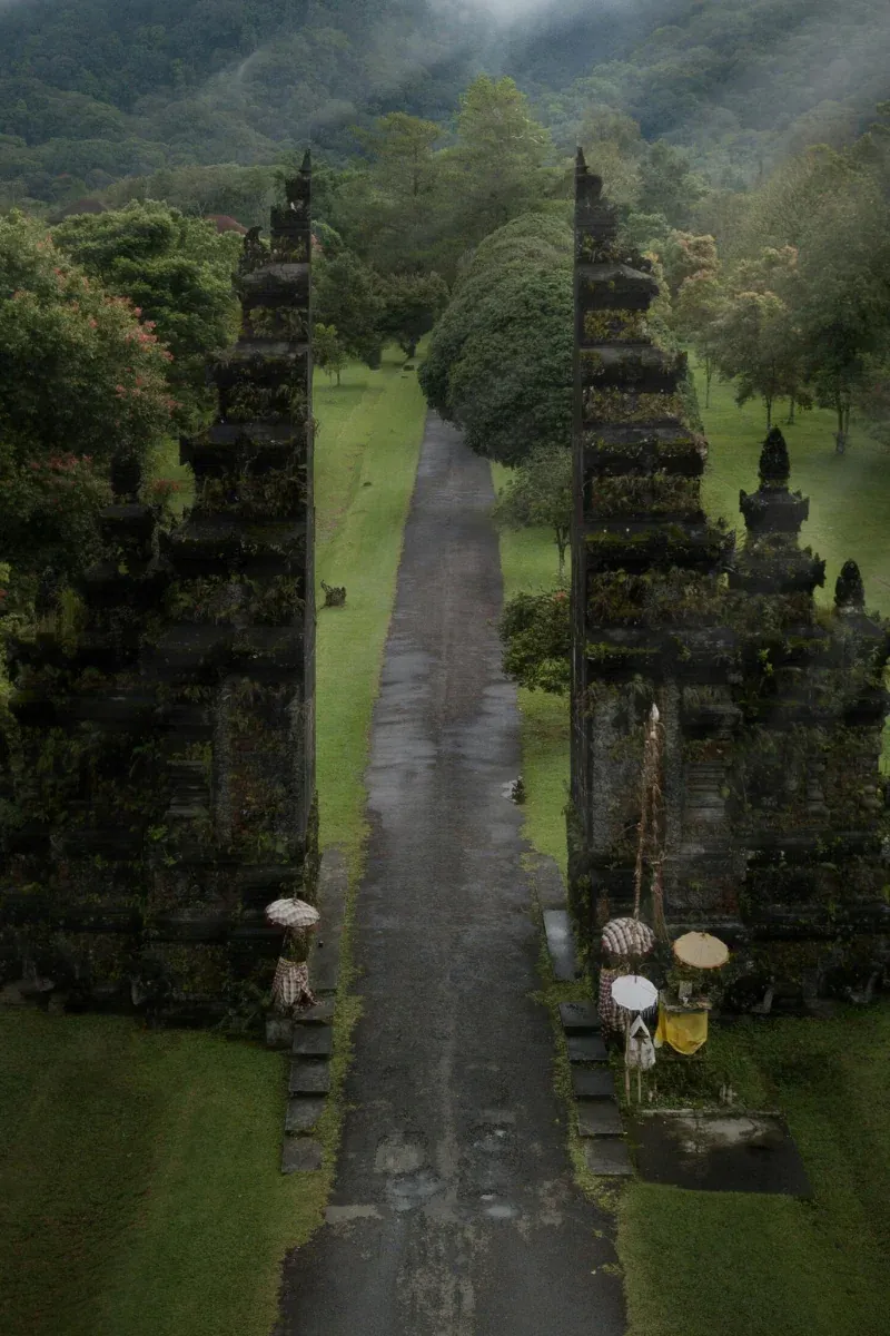 A candi bentar temple gate in the Balinese highlands, wrapped in mist